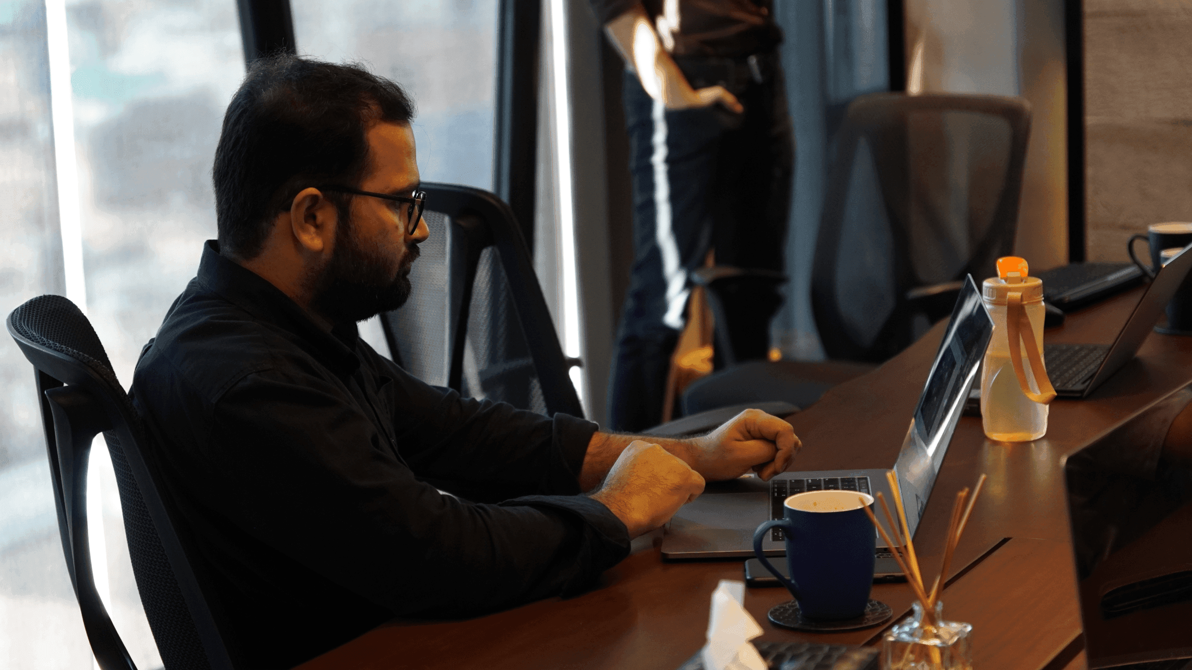Farrukh working at a desk